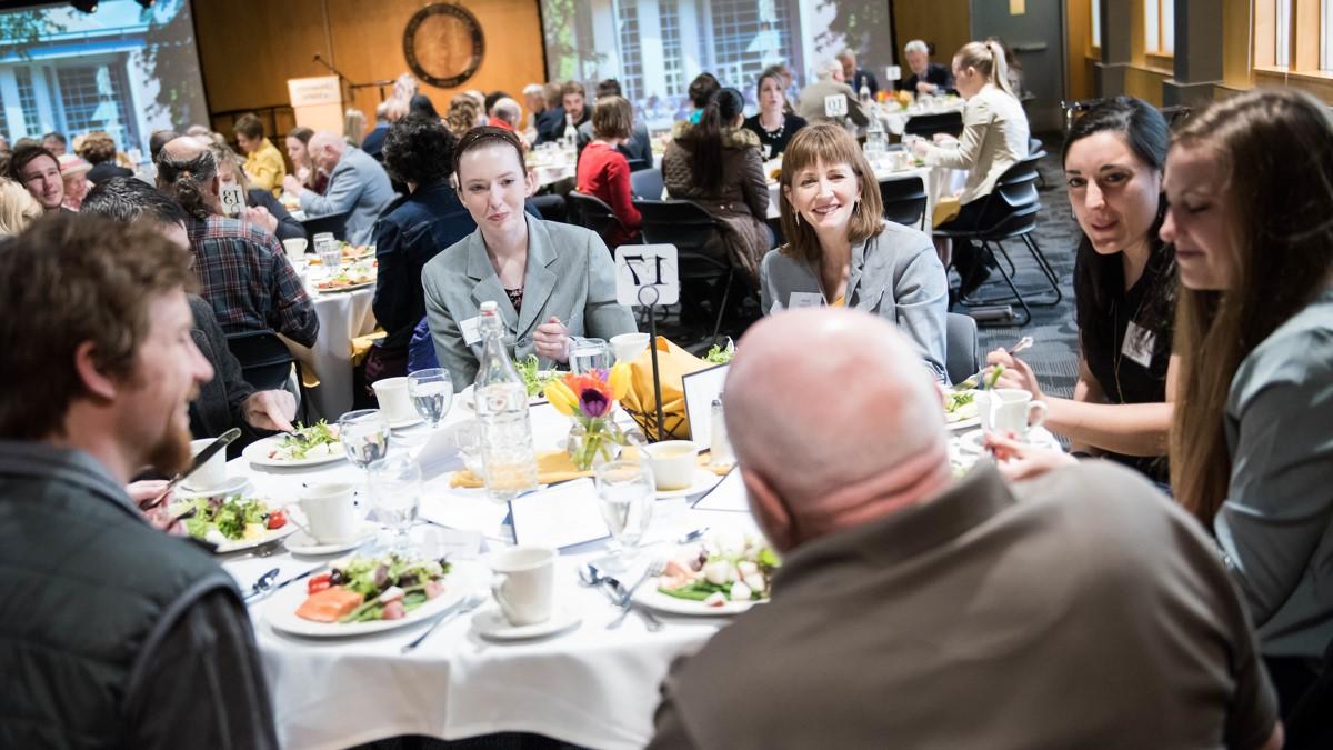 Attendees of a Scholarship Luncheon share a table in the Vandal Ballroom